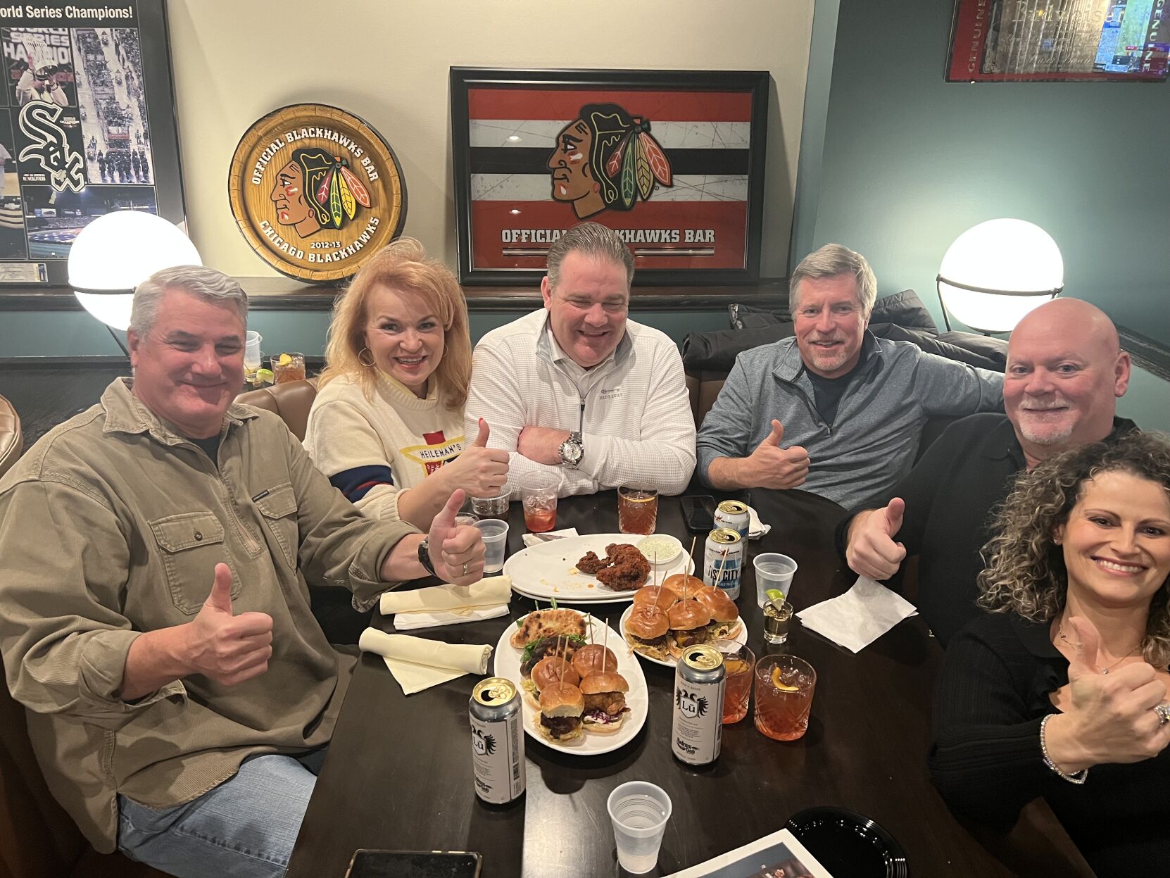 Investors Kelly and Bob Speck (center) with friends. (Photo Candace Jordan)